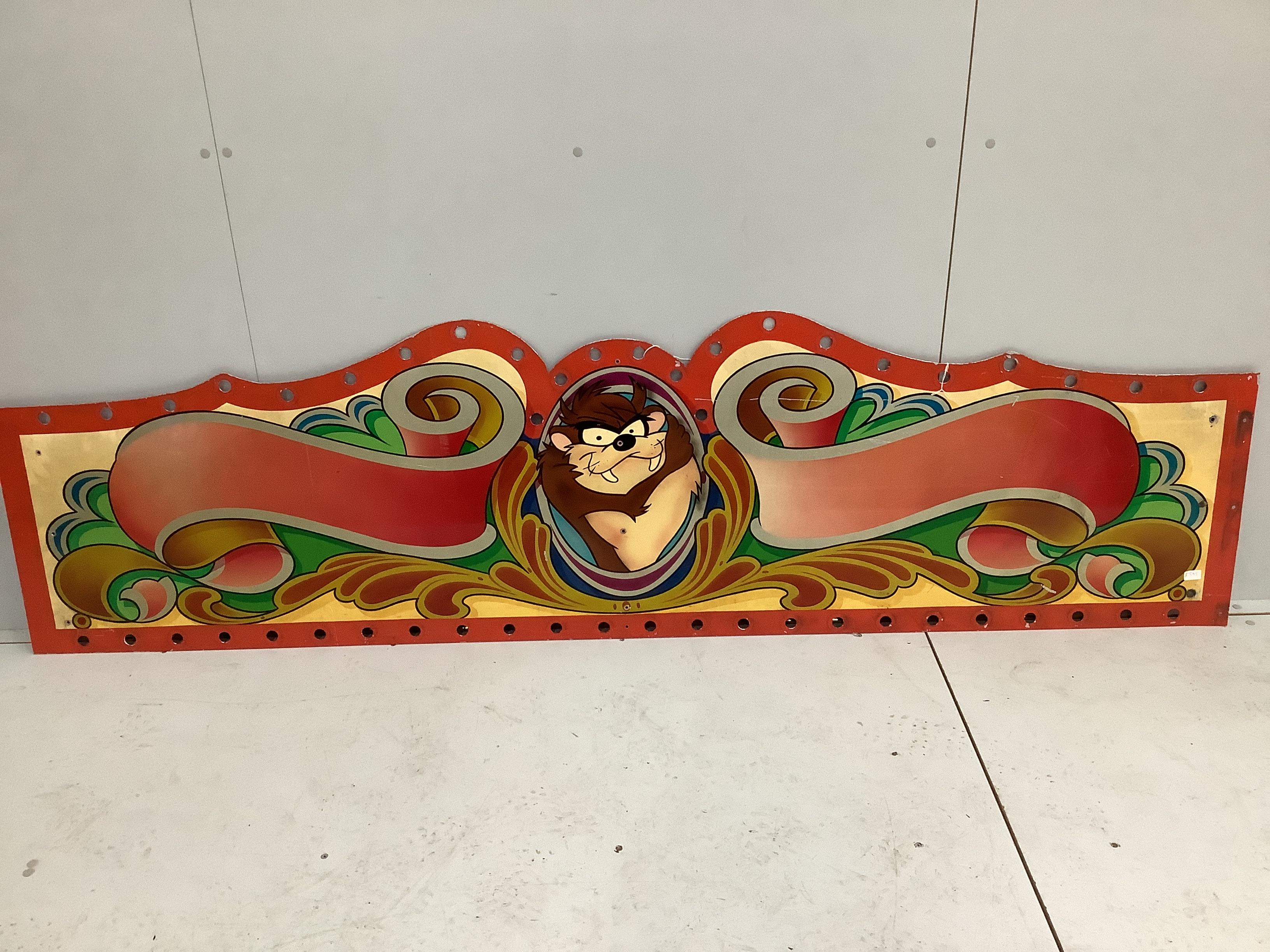 A vintage painted metal 'Taz' fairground panel, width 226cm, height 62cm